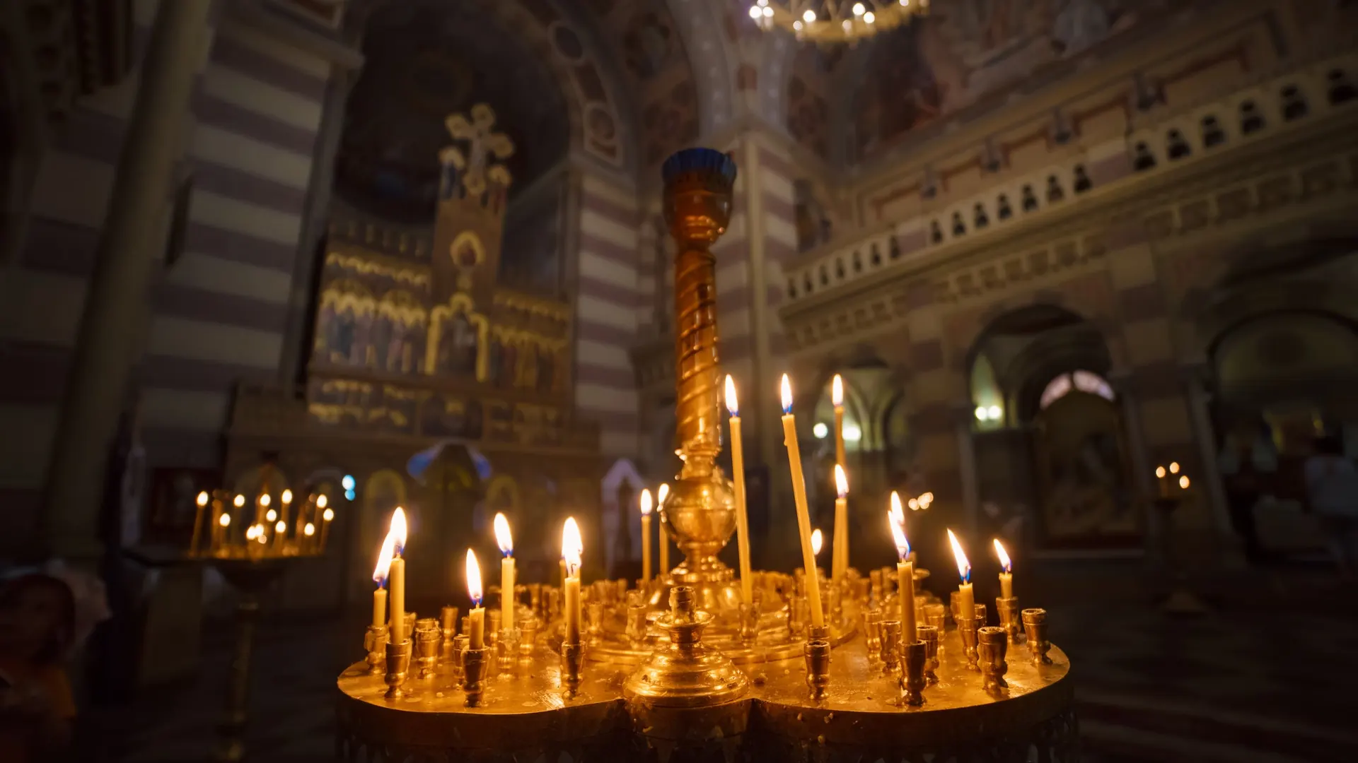 Golden candelabra with lit candles